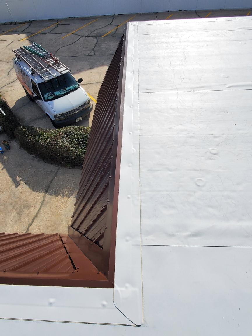 aerial view of completed roofing project by our Panama City Beach commercial roofers