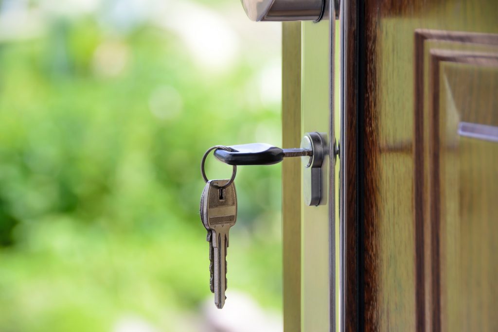 key in door of home for sale